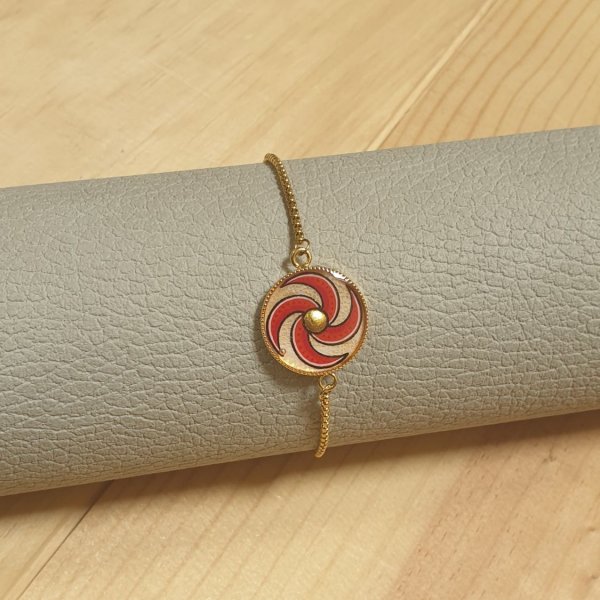Bracelet r&eacute;glable enluminure spirale rouge et or