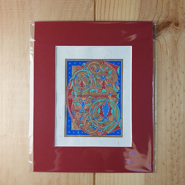 Bokstaven E i tidig gotisk stil, med ljus.