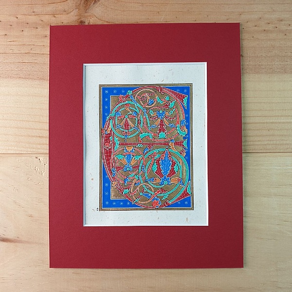 Bokstaven E i tidig gotisk stil, med ljus.