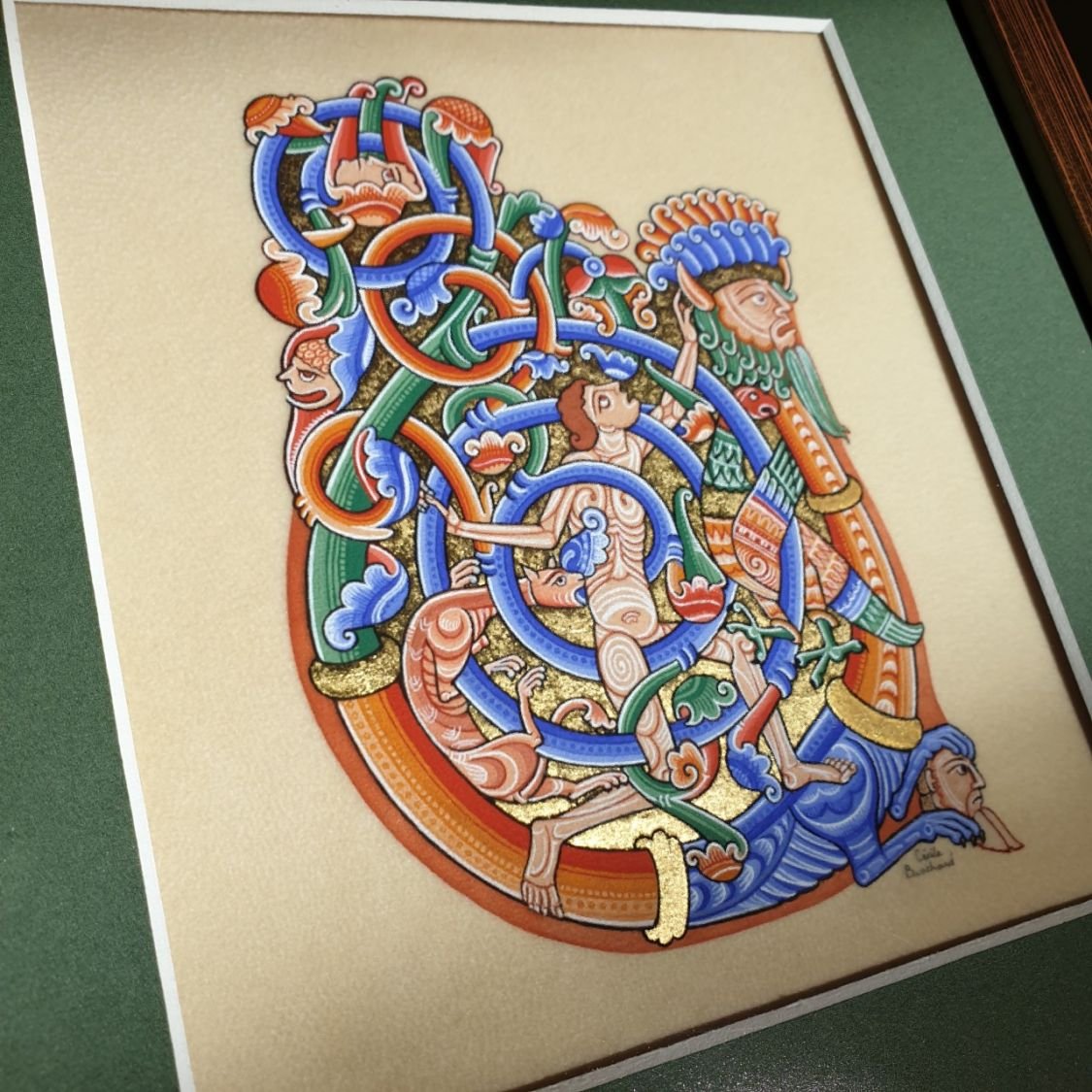 Romanesque illuminated bokstav U inramad