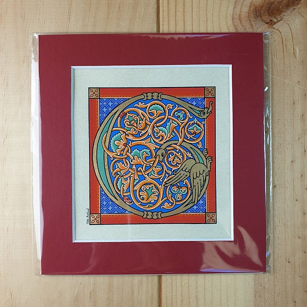 Bokstaven G i romansk stil med ljusskrift