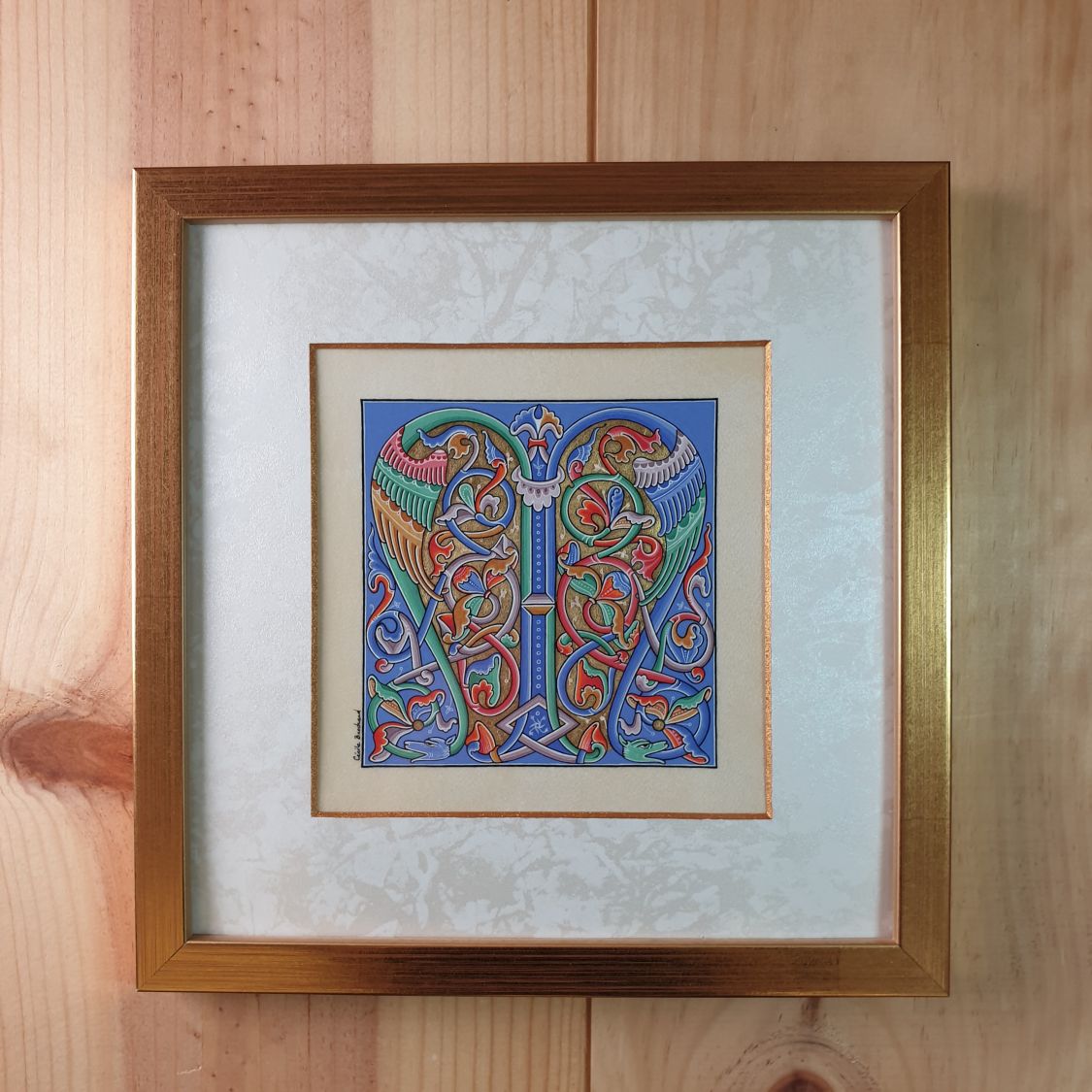 Romanesque illuminated bokstav M inramad