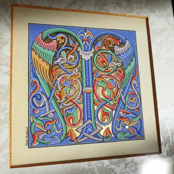 Romanesque illuminated bokstav M inramad