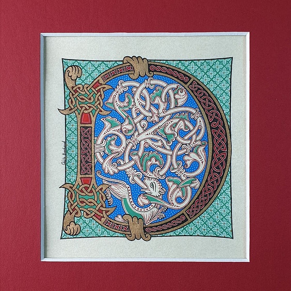 Bokstaven D i romansk stil med ljusskrift