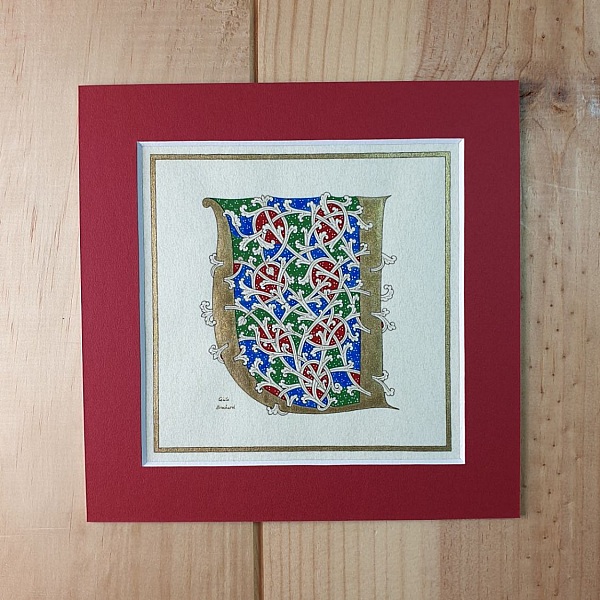 Bokstaven U i romansk stil, med ljus.