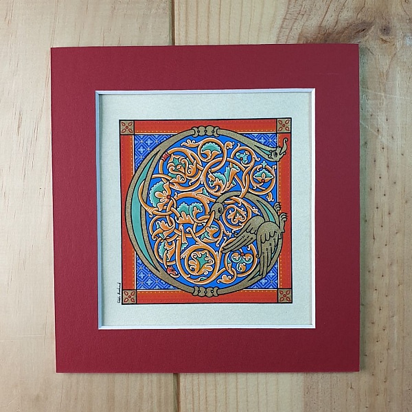 Bokstaven G i romansk stil med ljusskrift