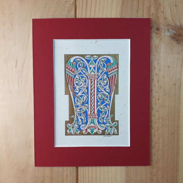 Bokstaven M i romansk stil, med ljus.