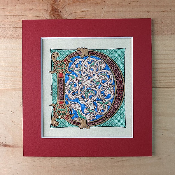 Bokstaven D i romansk stil med ljusskrift