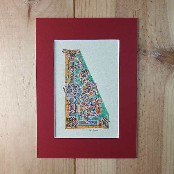 Bokstaven L i romansk stil, med ljus.