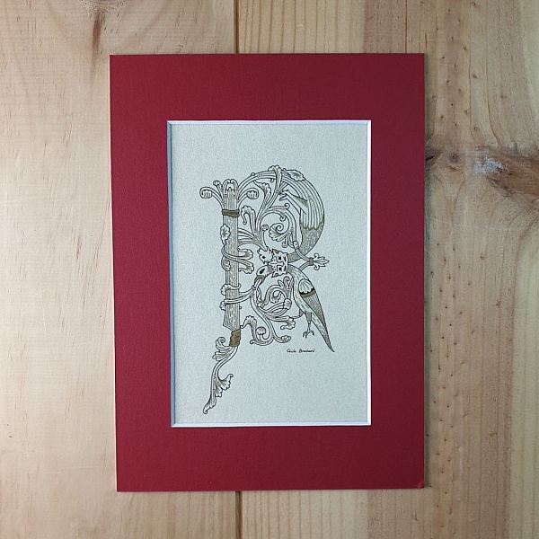 Bokstaven R i romansk stil med ljusskrift